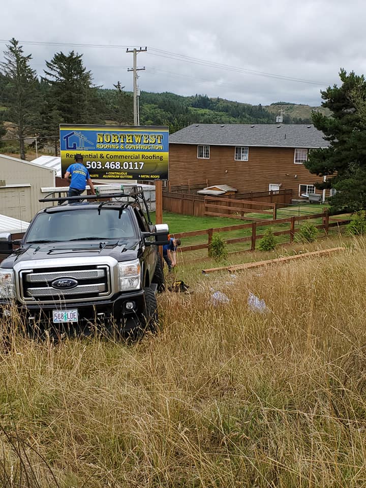 Man Standing in the Truck — Astoria, OR — Northwest Roofing & Construction LLC