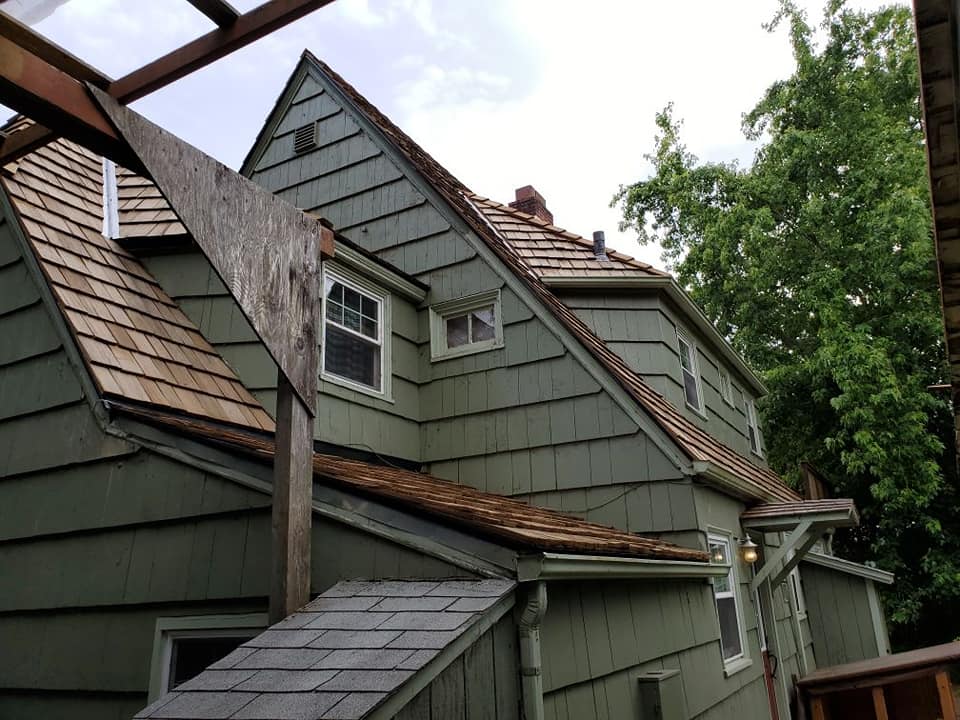 Residential House with Green Color — Astoria, OR — Northwest Roofing & Construction LLC