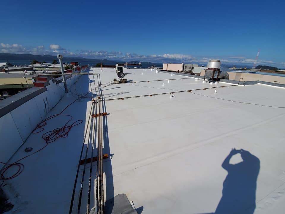 Rooftop With White Coating — Astoria, OR — Northwest Roofing & Construction LLC