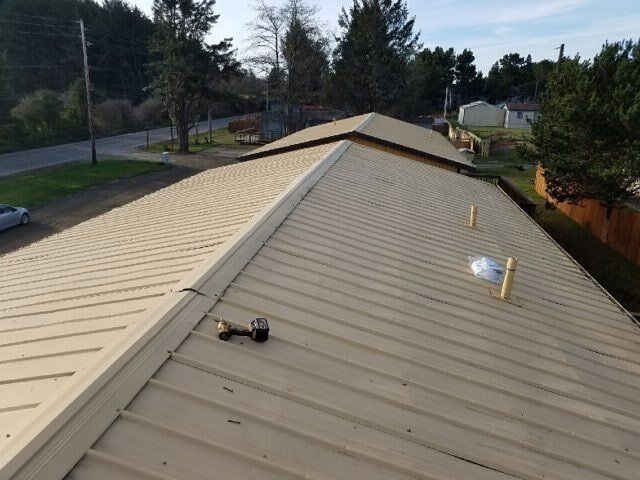 Beige Metal Roof — Astoria, OR — Northwest Roofing & Construction LLC