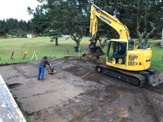 Flattening the Ground — Astoria, OR — Northwest Roofing & Construction LLC