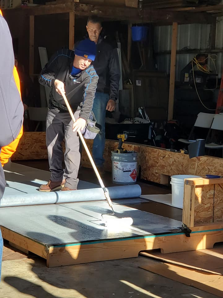 Man Applying White Paint — Astoria, OR — Northwest Roofing & Construction LLC