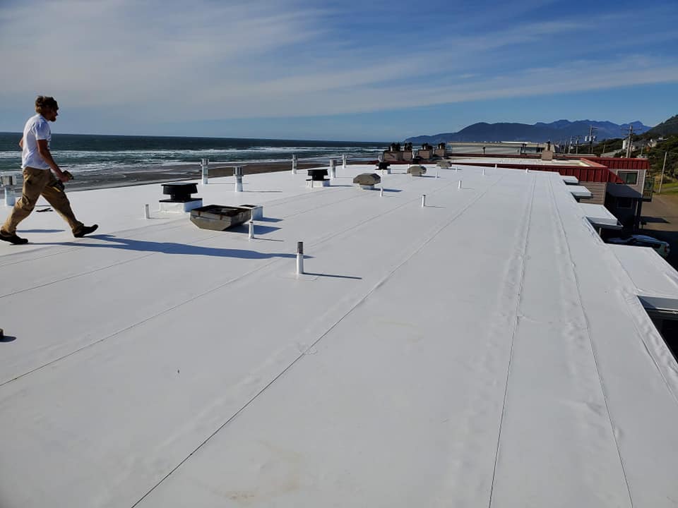 Man Walking On the Rooftop — Astoria, OR — Northwest Roofing & Construction LLC