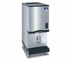 Commercial ice machine with black top and front grill, stainless steel body.