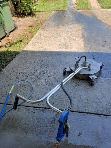A Machine is Sitting on Top of a Wooden Deck — DJ's Pressure Cleaning In Carruchan, QLD