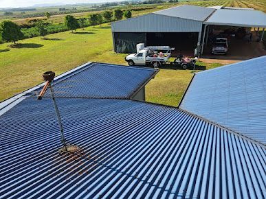 A Large Brick House Sits on the Side of the Road — DJ's Pressure Cleaning In Carruchan, QLD