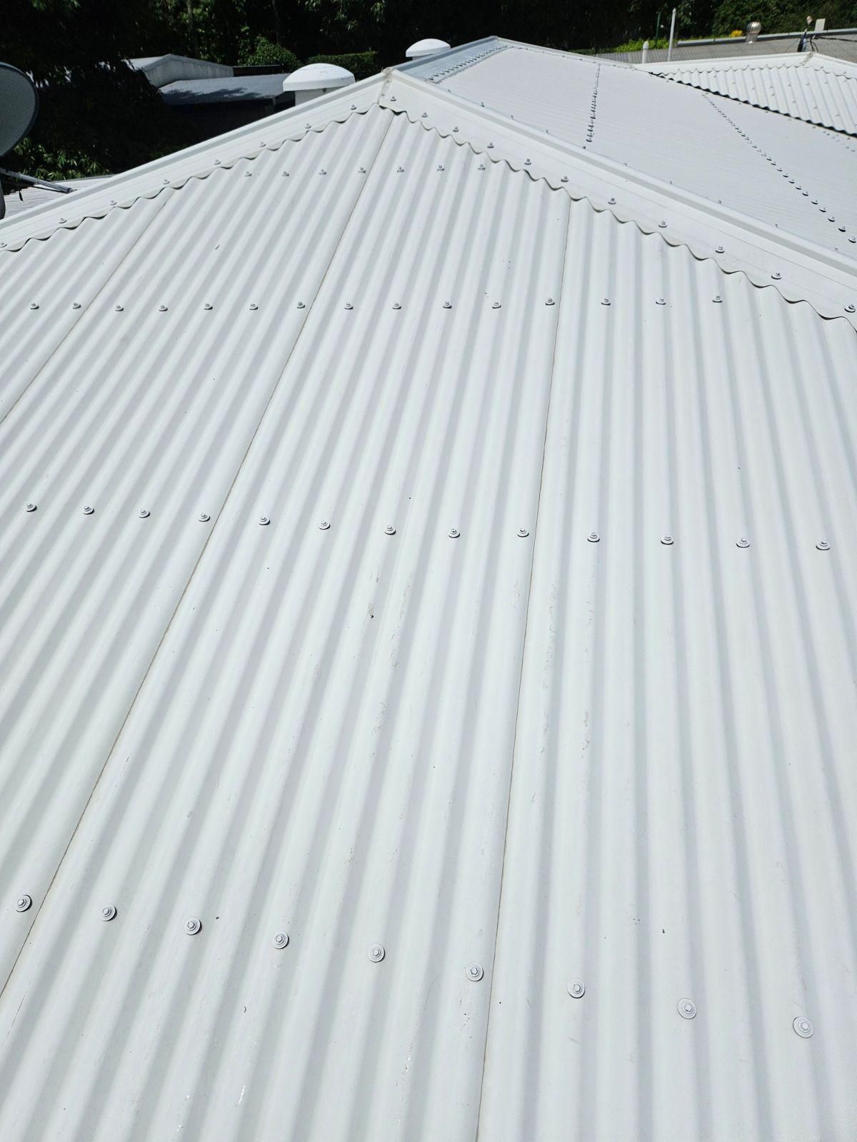 A White Corrugated Metal Roof With a Satellite Dish on Top of It — DJ's Pressure Cleaning In Carruchan, QLD
