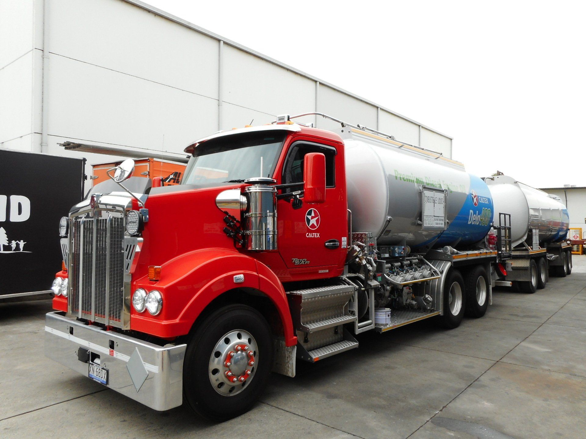 A Group Of Men Are Working On A Machine In A Factory — Newcastle Truck Repairs in Thornton, NSW