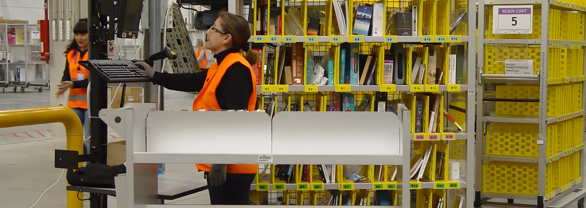 Picture inside a warehouse, looking at AI sorting. 