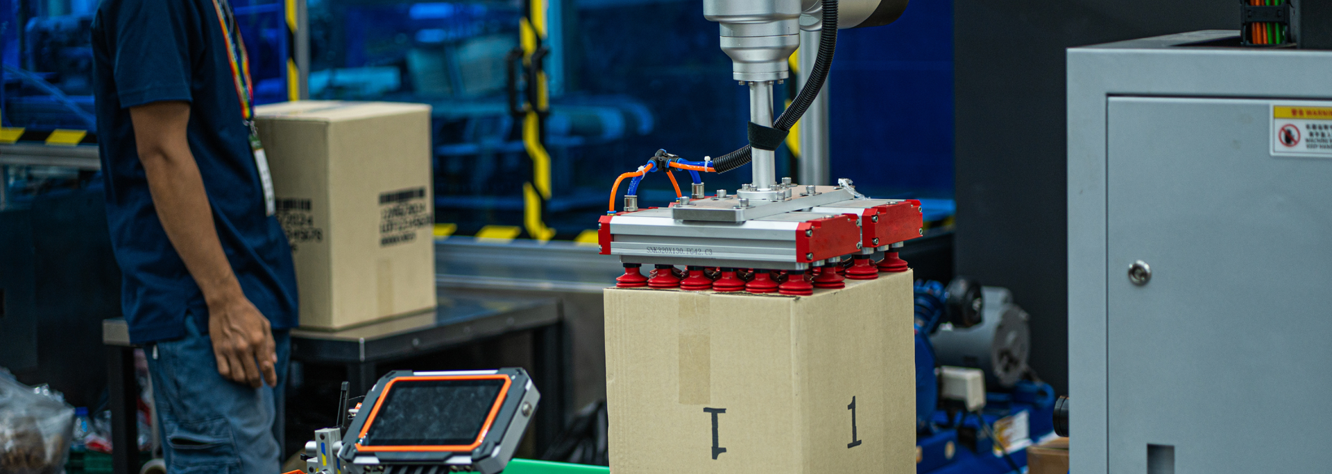 Picture of a robotic arm with suction grabbers. 