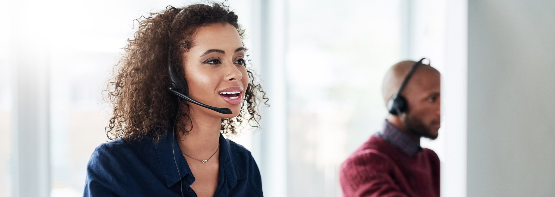 Picture of a young woman answering a call. 