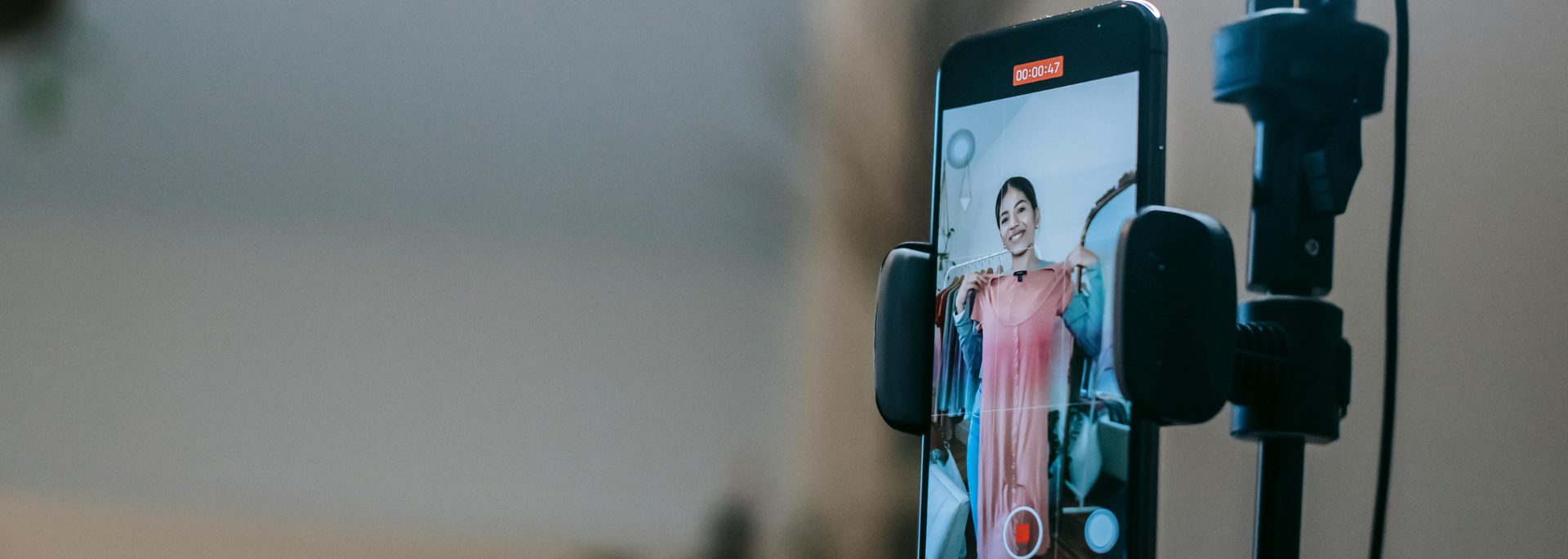 Picture of someone recording themselves. 