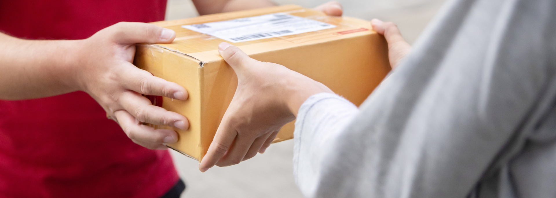 Picture of someone handing over a parcel. 