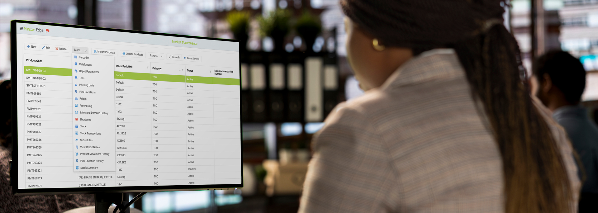 Picture of someone using Minster software in an office setting. 