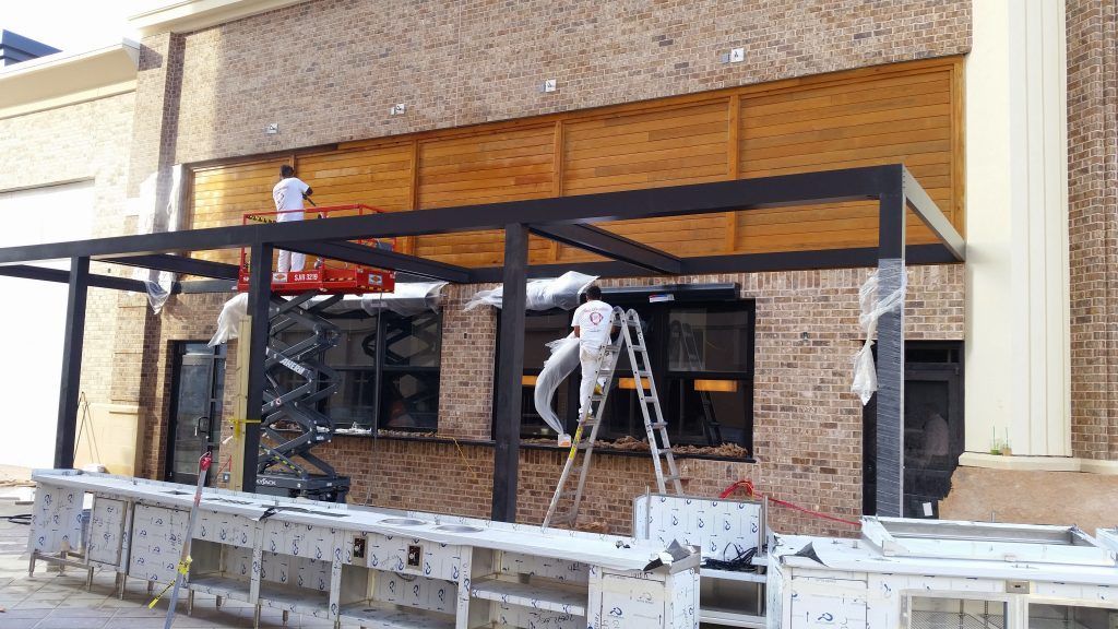 A group of people are working on a building.