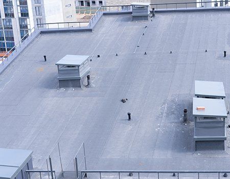 Flat Roofing Installations — Apartment Building Roof Top in Miami, FL