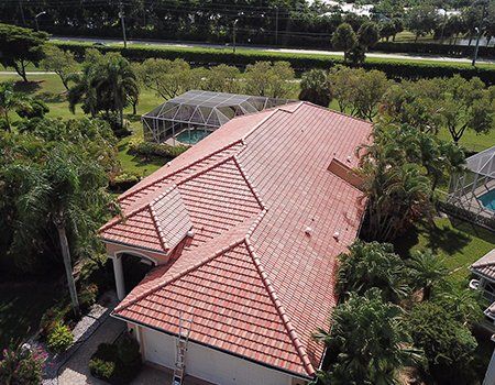 Roofing Contractor — Aerial View of House with Tile Roofing in Miami, FL