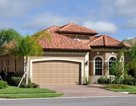 Tile Roofing Expert — Family House with Tile Roofing in Miami, FL