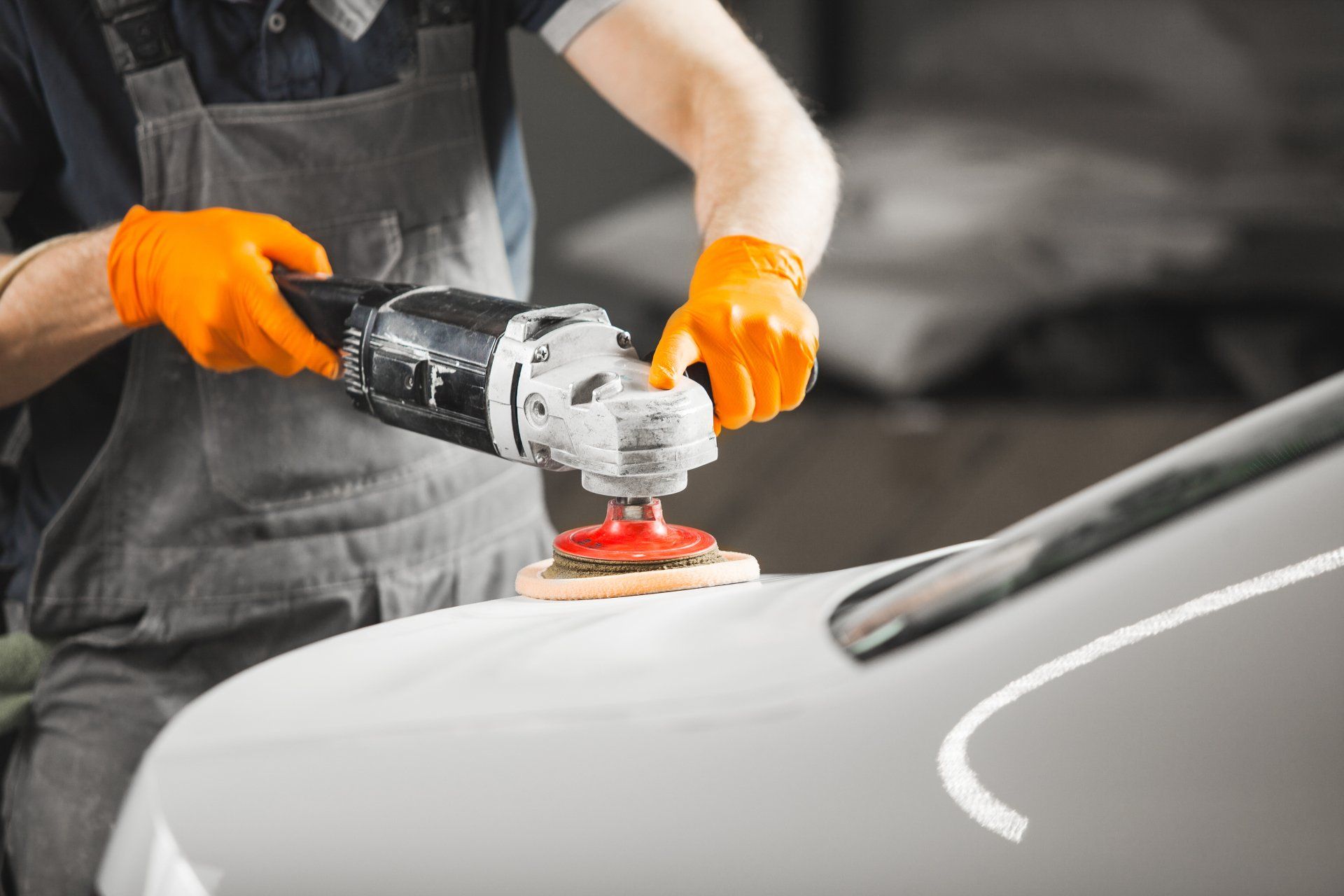 stock-photo-worker-polished-white-car-with-orbital-polisher-in-auto-repair-shop-close-up-vehicle-detailing-1452323378-1920w.jpg