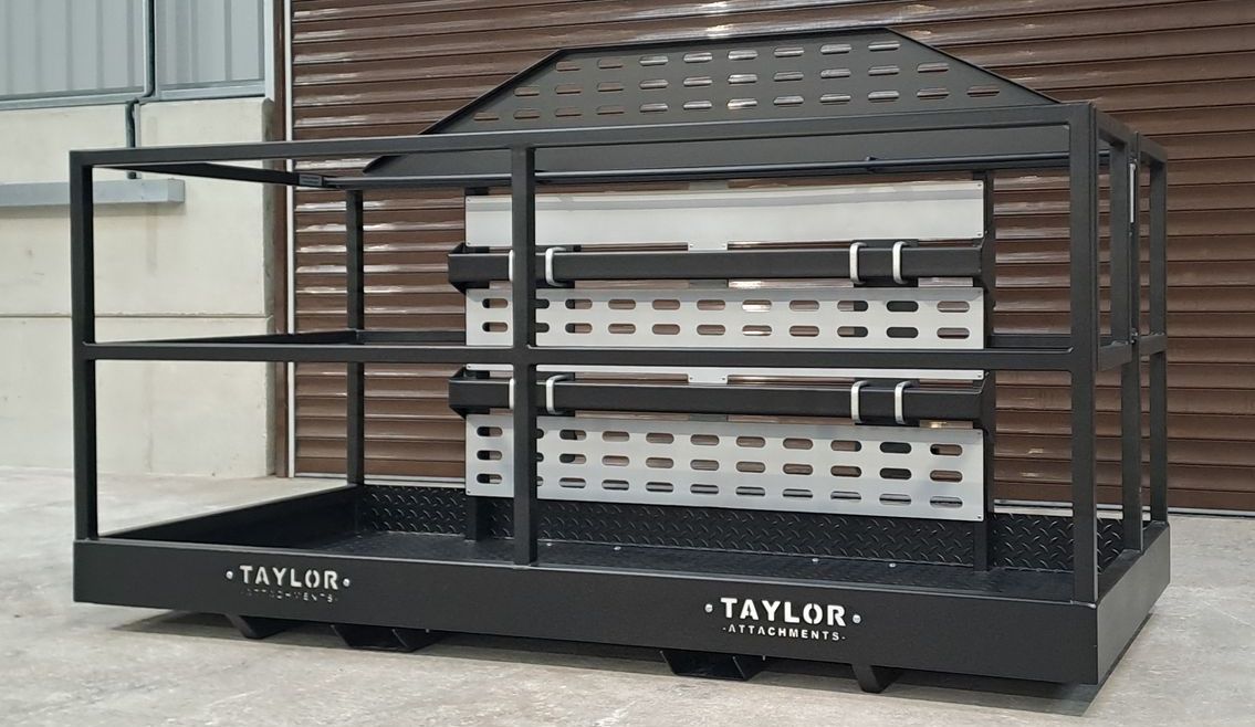 A taylor crate is sitting in front of a building