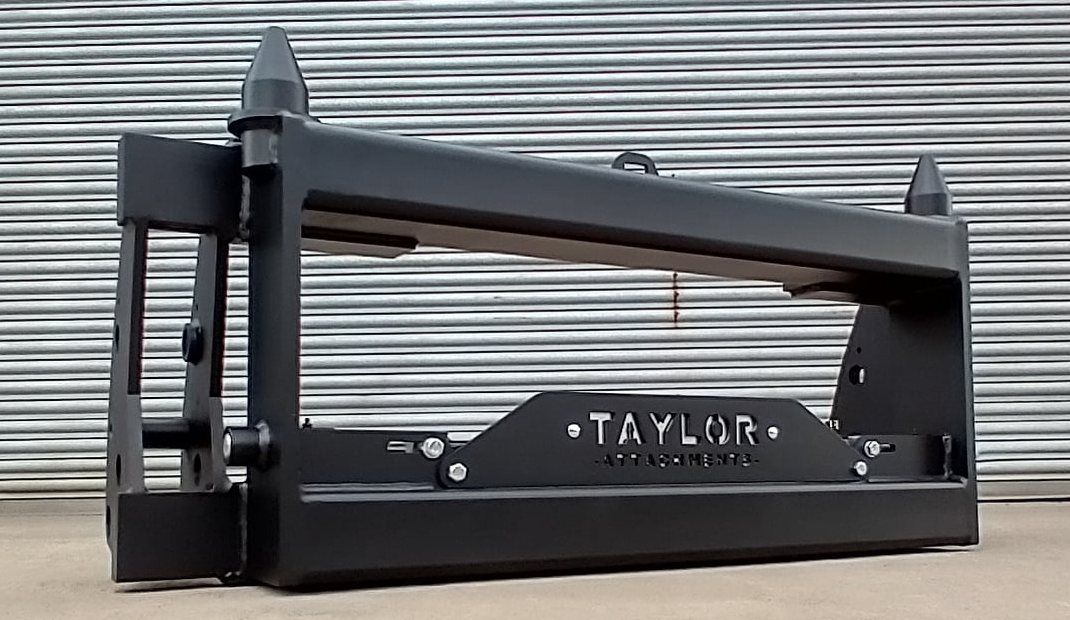 A black metal object with the word taylor on it