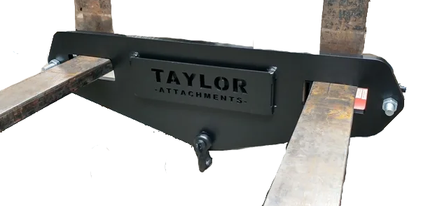 A forklift is sitting on top of a wooden table.