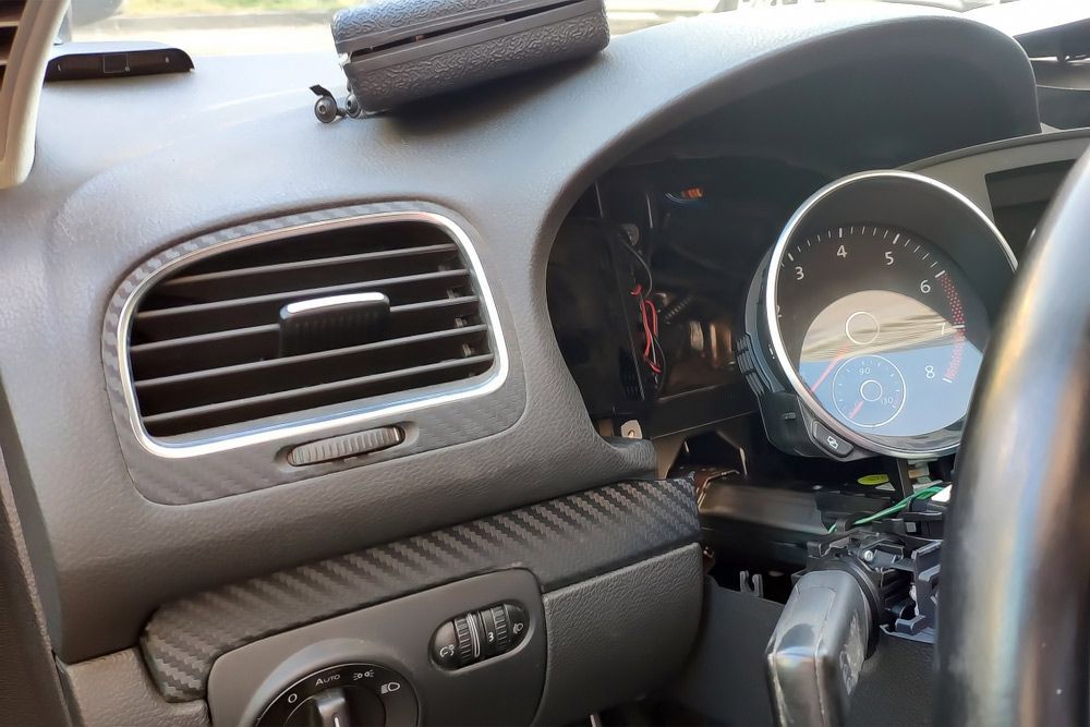 Auto Electrician Installing A Security Alarm In A Modern Car — A-Lect Auto Electrical & Air Conditioning In Garbutt QLD