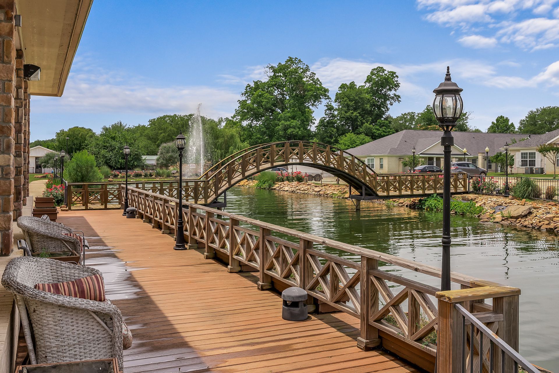 A wooden dock with a bridge over a body of water.