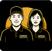 Two staff in black uniforms with yellow trim and “SUPERIOR” logos on a black and gold background