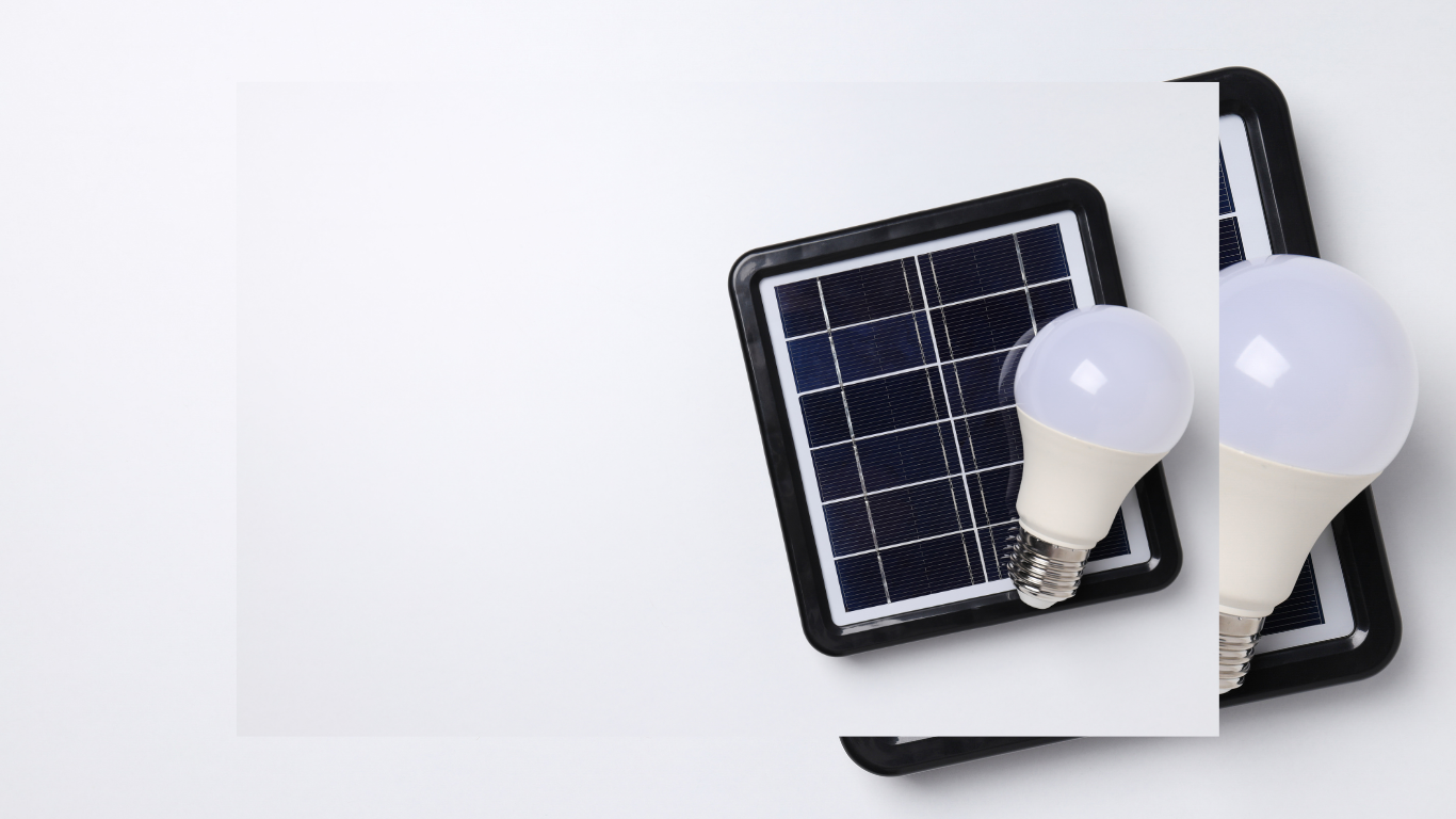 Solar panel with two white LED light bulbs on white background.