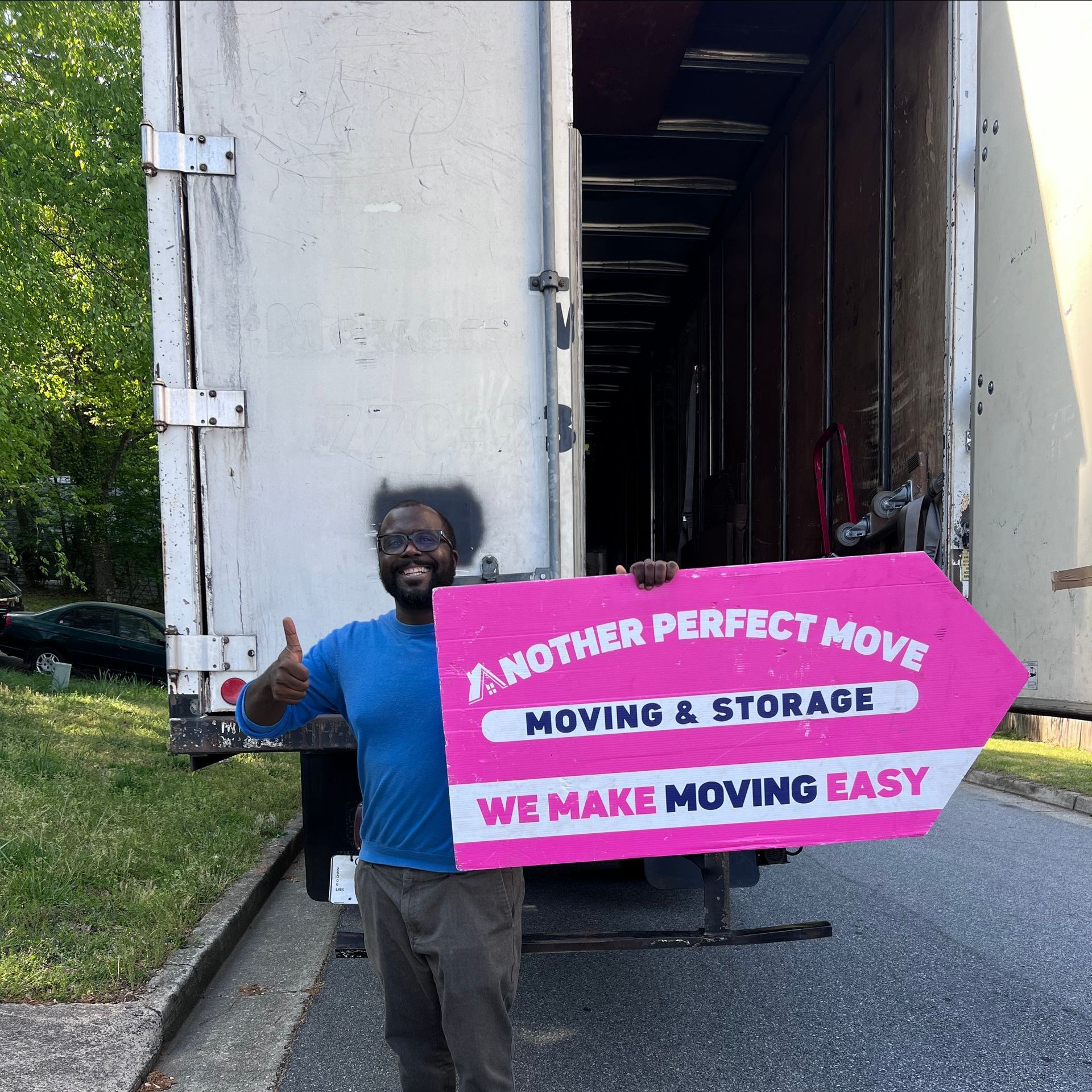 A man holding a sign that says another perfect move