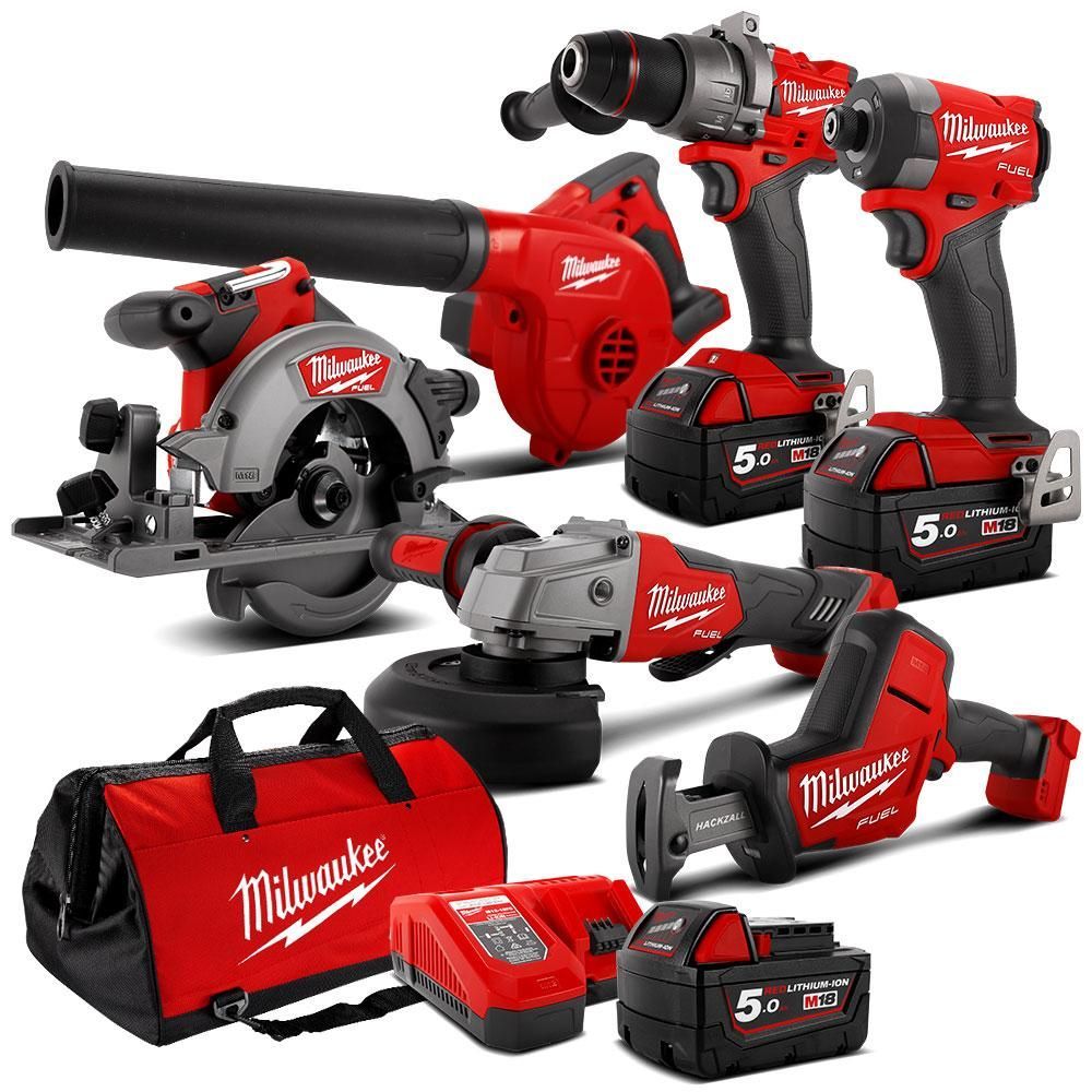 Red Milwaukee power tools: circular saw, blower, drill, impact driver, grinder, and sawzall with bag and charger.