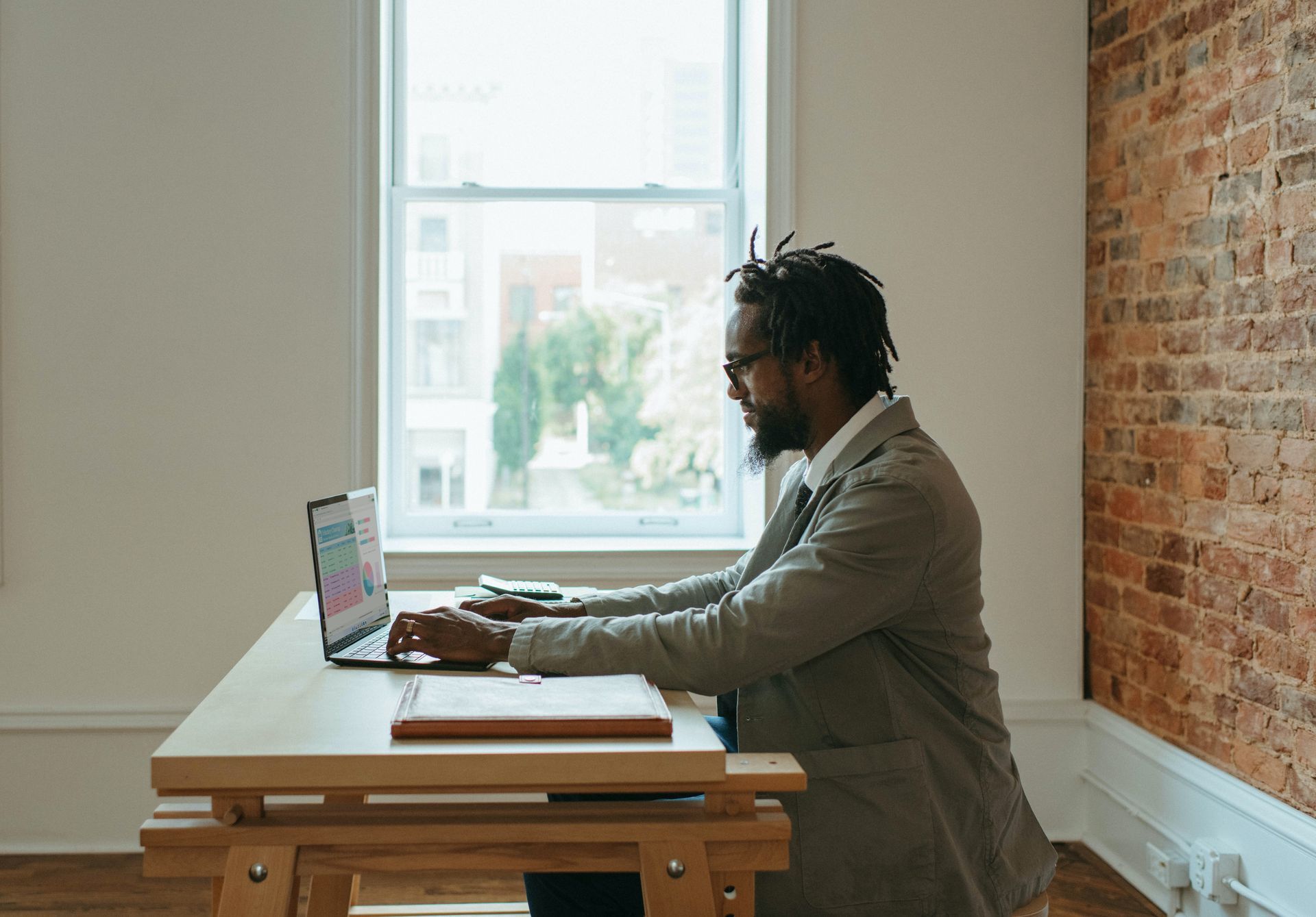 man leading an online meeting