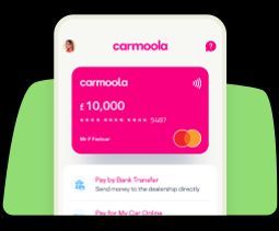 A cell phone with a pink card on the screen.