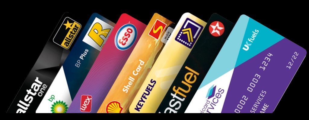 A bunch of credit cards are lined up in a row