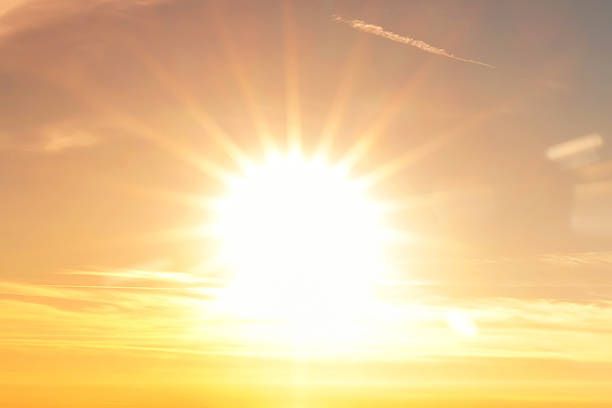 Bright sunshine filtering through the clouds.