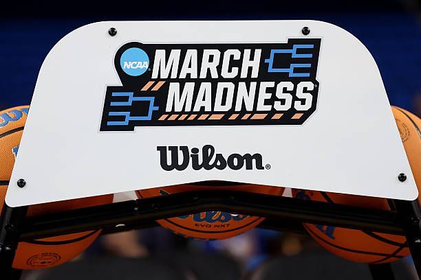 March Madness logo sign with basketballs.