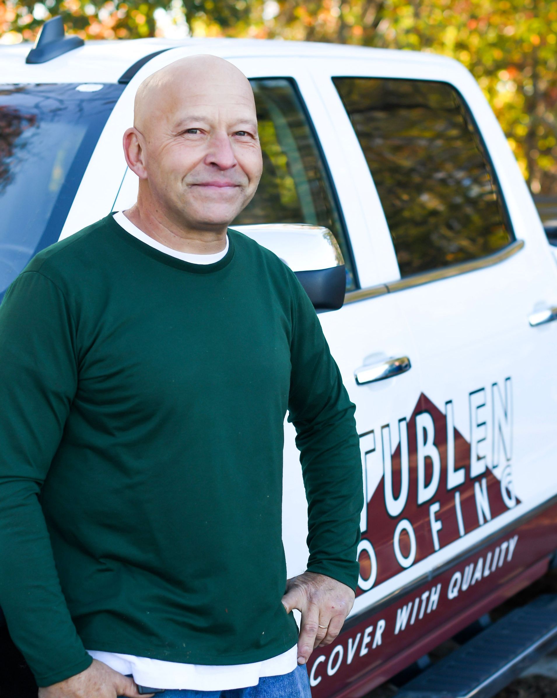 roof repair technician smiling