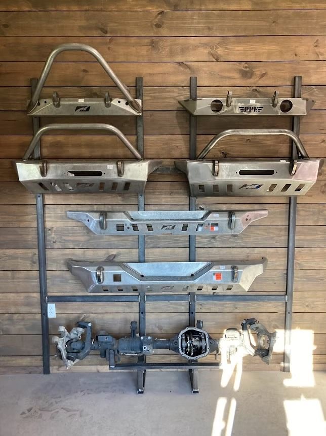 There are many different types of bumpers on display on the wall.