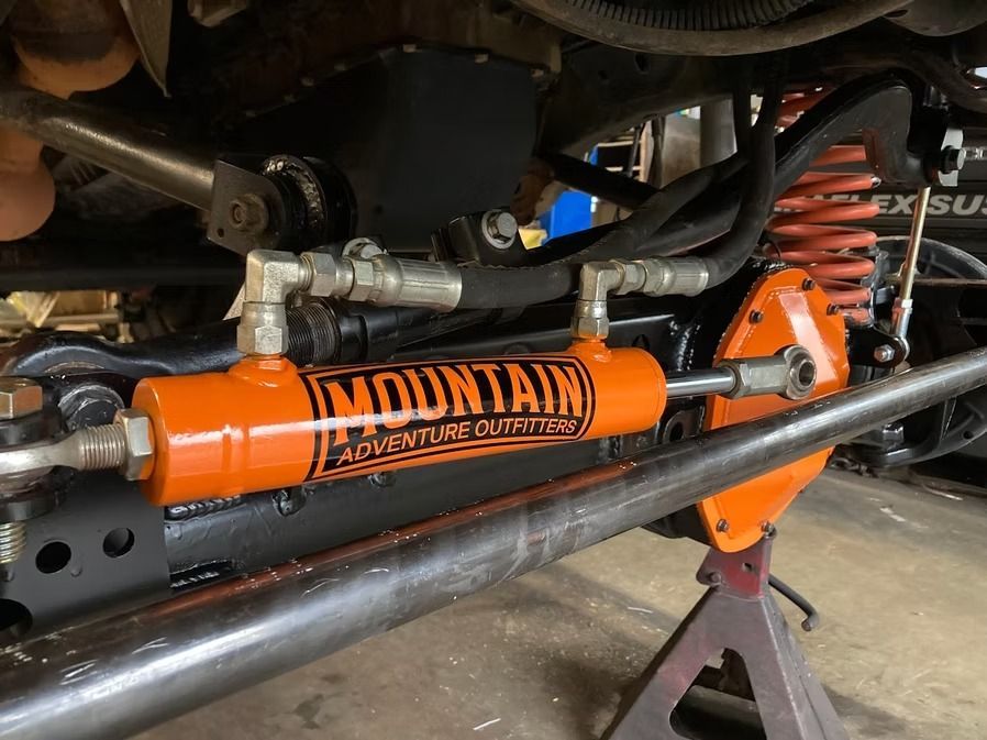 A close up of a hydraulic steering system on a vehicle.