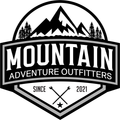 A black and white logo for mountain adventure outfitters.