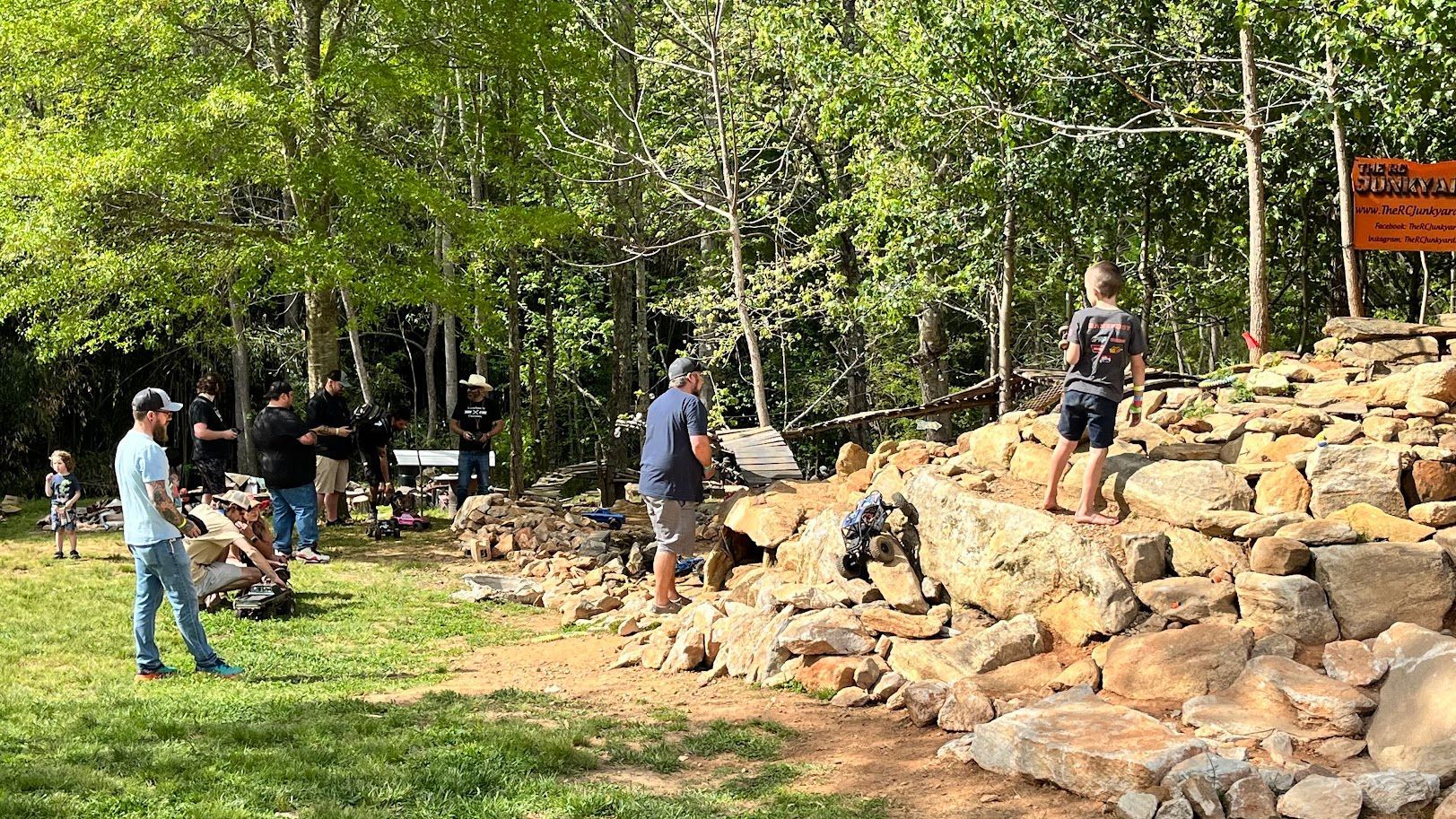 An aerial view of a garage with a bunch of jeep 's parked in front of it.
