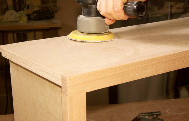 A Worker Sanding A Cabinet Wood — Lee's Summit, MO — Anthony's Painting