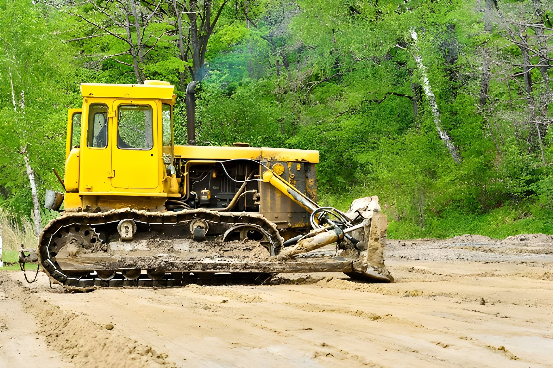 Yellow Bulldozer on Dirt Road, Clearing Land Near Green Trees — Garden City Slashing in Highfields, QLD