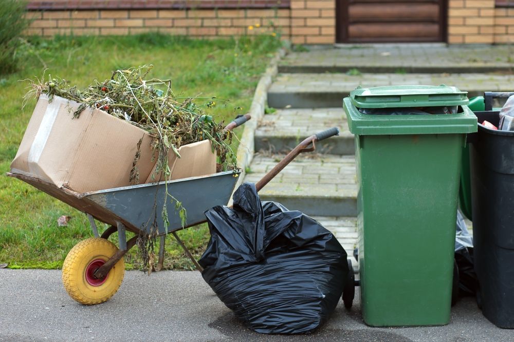 Wheelbarrow With Yard Waste and Cardboard Box — Garden City Slashing in Highfields, QLD