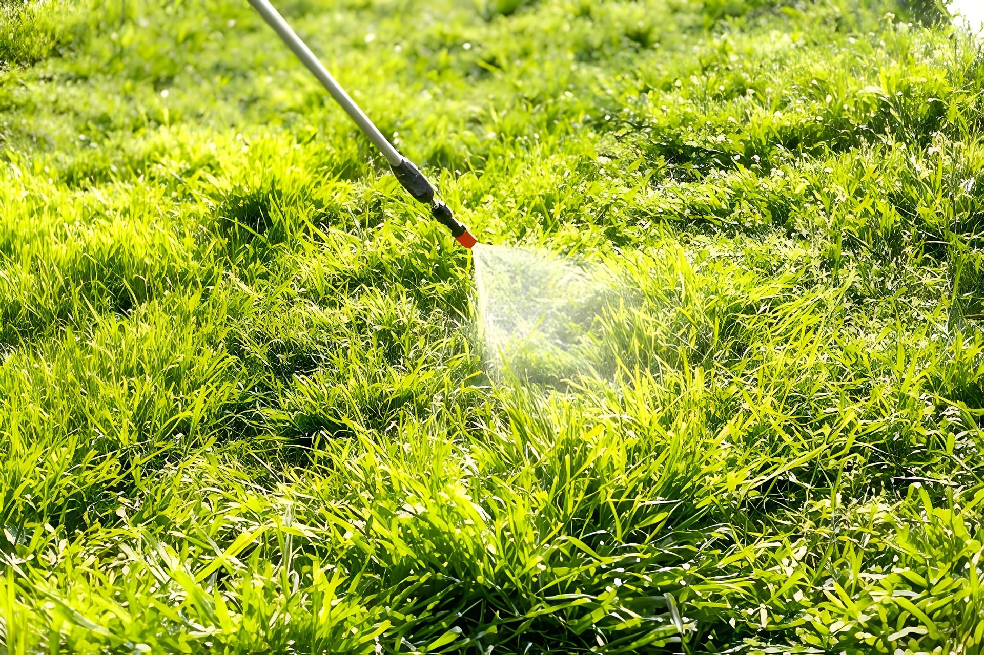 Sprayer Applying Liquid to a Patch of Green Grass — Garden City Slashing in Toowoomba, QLD