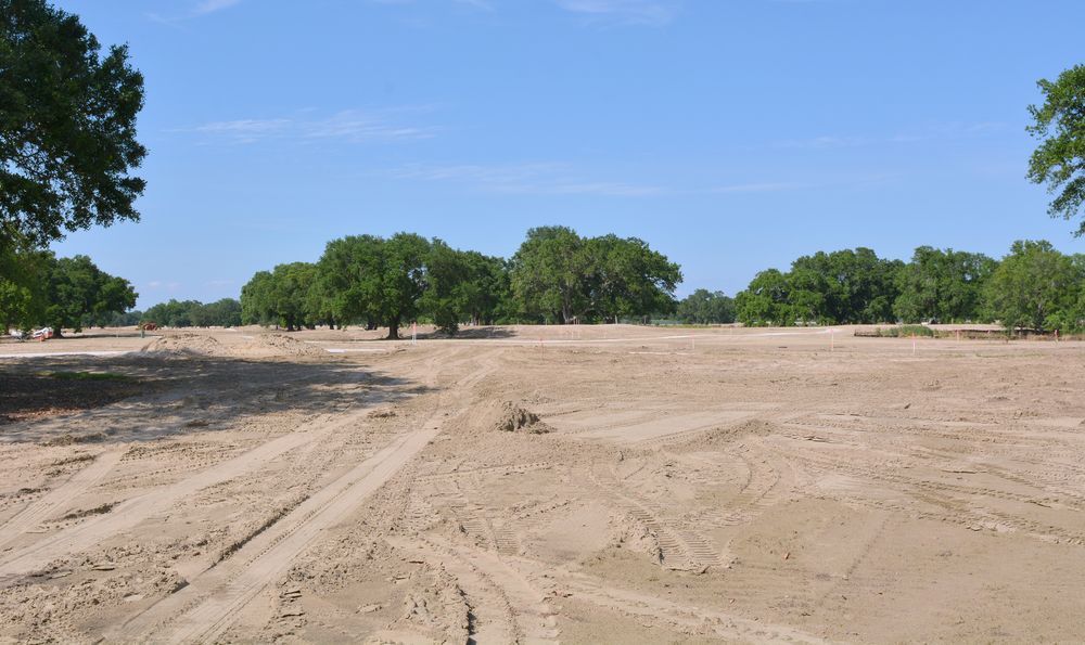 Cleared Sandy Land With Tire Tracks Under a Bright Blue Sky — Garden City Slashing in Highfields, QLD