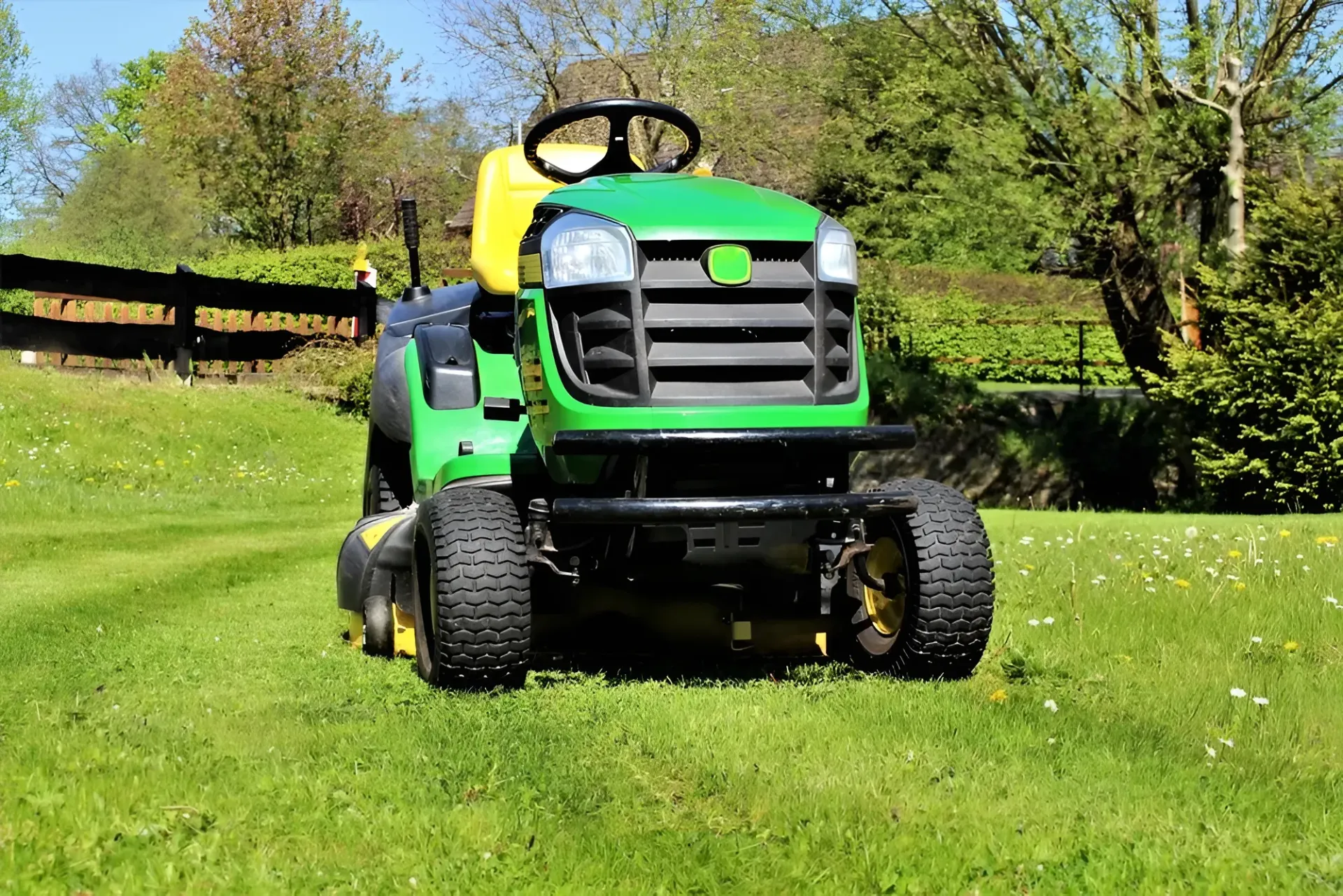 Green John Deere Riding Lawn Mower on Grass — Garden City Slashing in Highfields, QLD