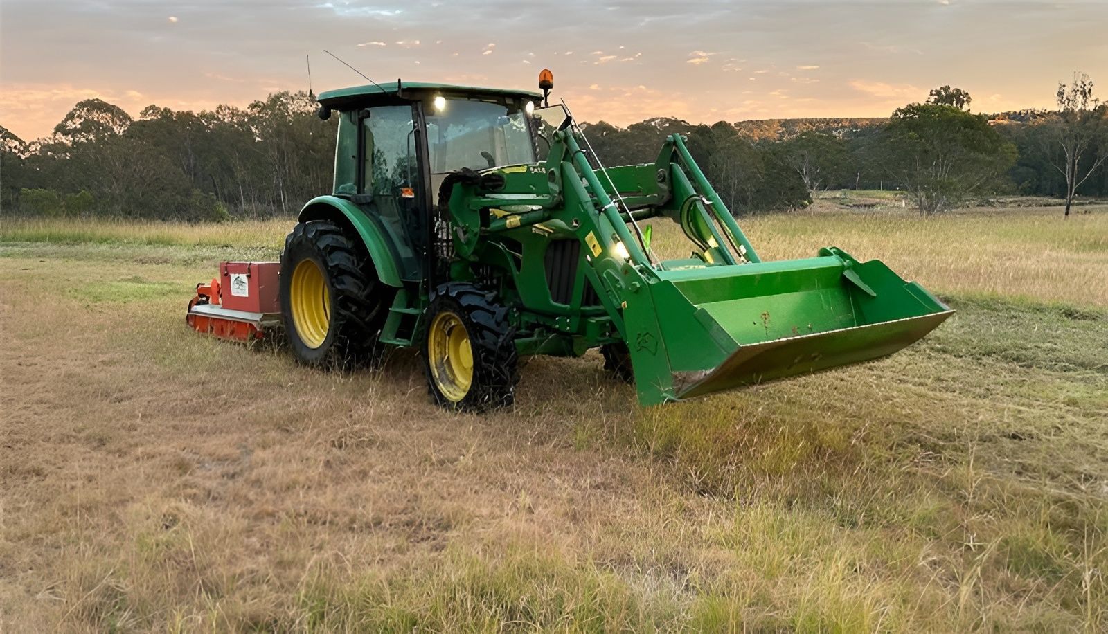 Green John Deere Tractor With Loader Bucket and Mower in a Field — Garden City Slashing in Highfields, QLD