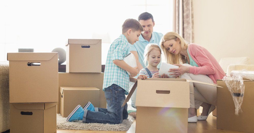 Family Unpack Items from the Boxes — Professional Removalists in Cowra, NSW